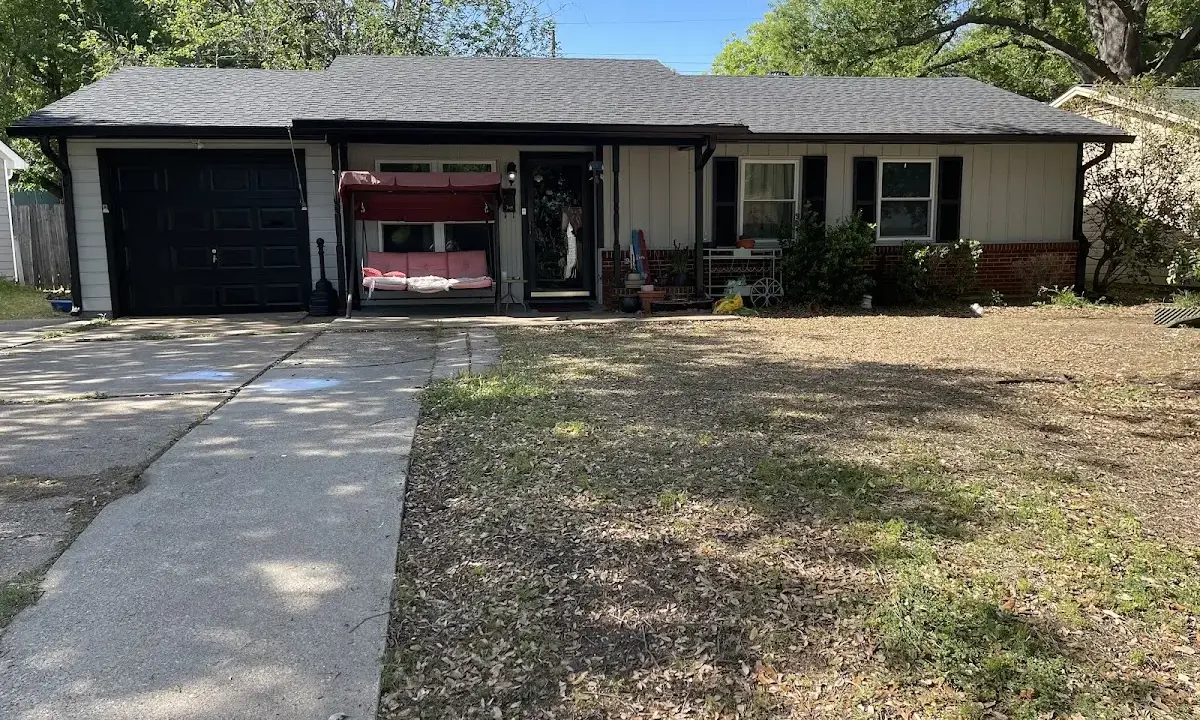Asphalt Shingle Roof Repair crew at work on a residential roof in Jacksonville